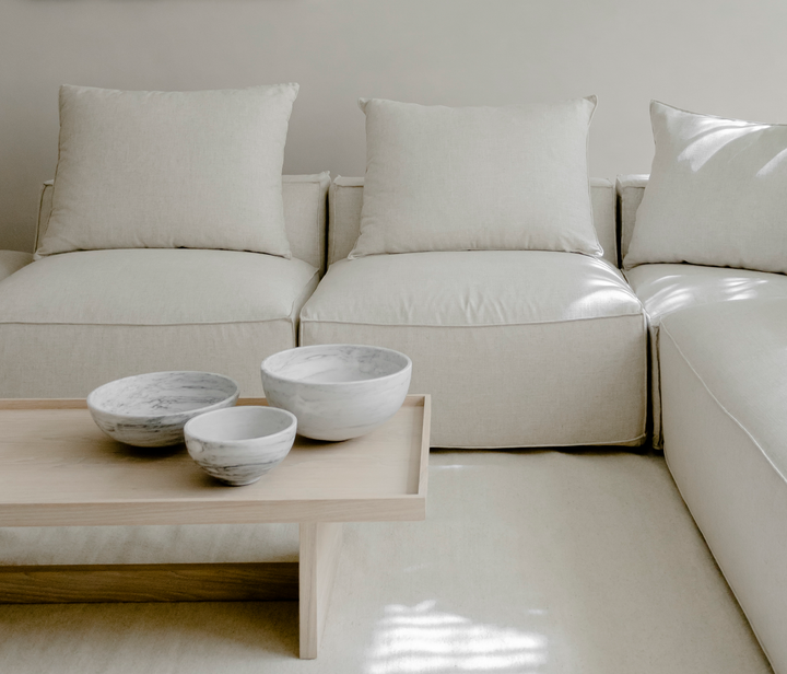 white marble accessories staged in a white living room