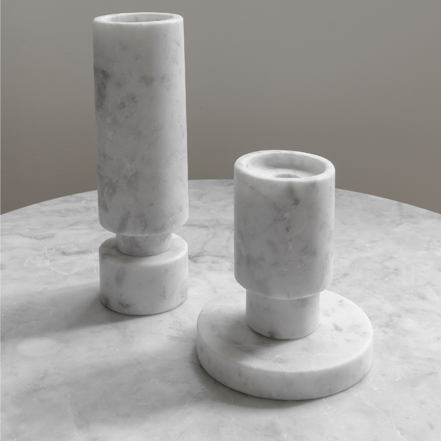 closeup of white marble candle holders