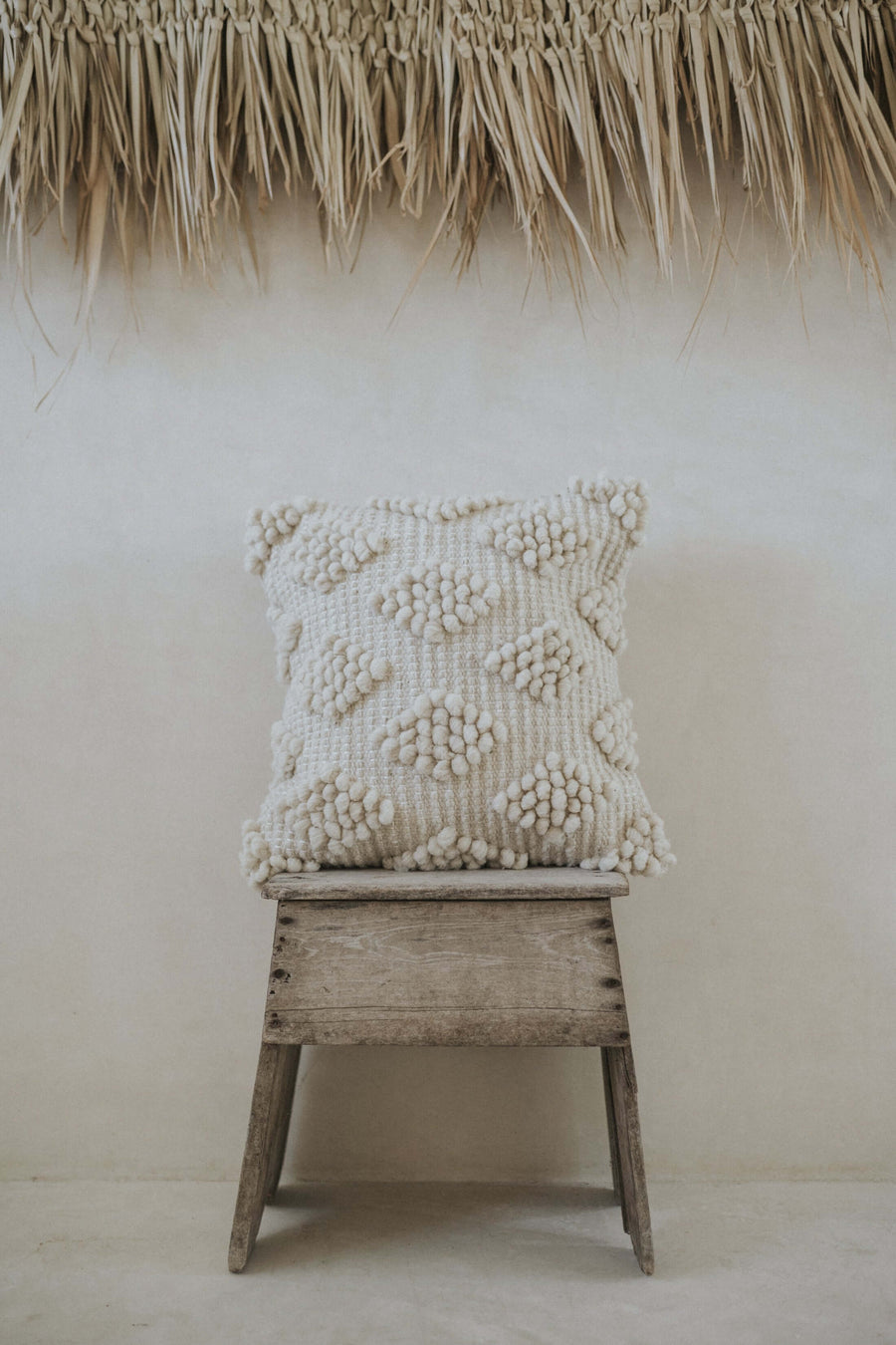 handmade wool textile pillow with diamond pattern